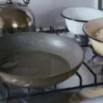 Can you spray a cast iron skillet with pam