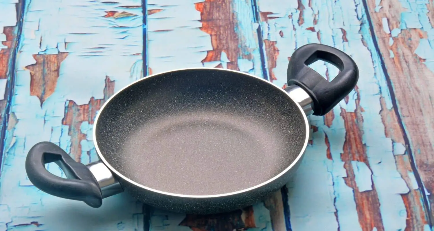 Why do frying pans bow in the middle?