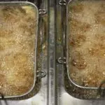 How much oil does deep frying absorb?