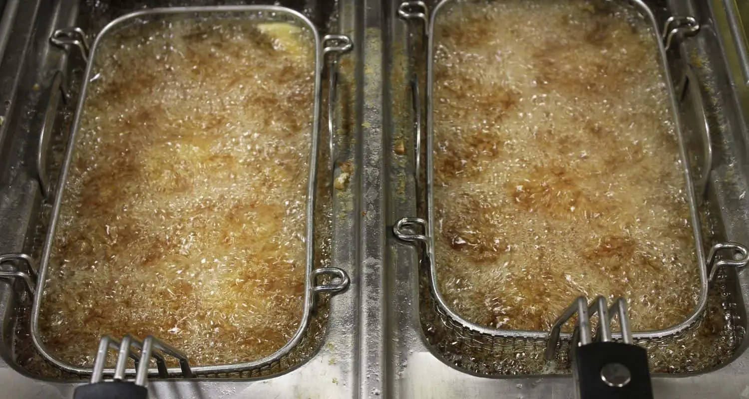 How much oil does deep frying absorb?