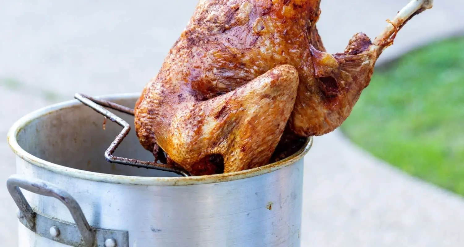 How much oil does a turkey fryer take?  