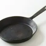Why does my cast iron skillet has black residue?